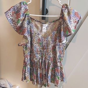 Floral top, size medium, flutter sleeves, and flutter bottom, V-neck,NWOT